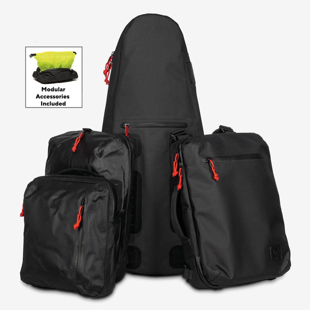 A black Tennis Travel Bundle from Cancha, featuring a guitar-shaped bag and three smaller bags with red zipper pulls, arranged in front of a white background. An inset showcases the included travel accessories, such as the Racquet Bag Voyager and wet-dry bag components.